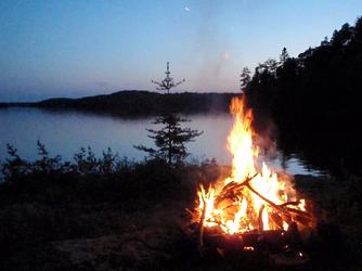 Relaxing by the camp fire on Loonhaunt Lake